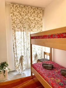 Postel nebo postele na pokoji v ubytování SUNNY HOLIDAY HOME