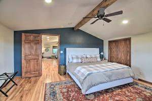 A bed or beds in a room at Lovely Barn Loft with Mountain Views on Horse Estate