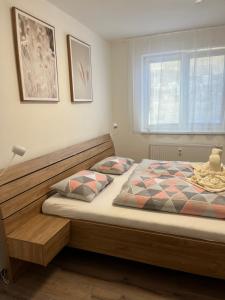 מיטה או מיטות בחדר ב-Nový Apartmán v areálu Wellness hotelu Frymburk