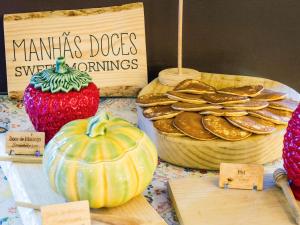 a display of cookies and pumpkins on a table at Hotel Ibis Lisboa Sintra in Sintra
