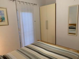Posteľ alebo postele v izbe v ubytovaní Apartments Mais Tisno