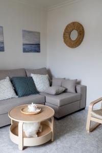 a living room with a couch and a table at LXR Waikiki Beach Front 3Hab. Tarifa in Tarifa