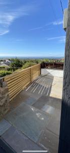 a wooden fence on top of a building at Ifan cottage - two bedroom cottage in Meliden