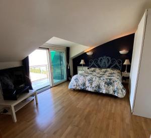 a bedroom with a bed and a wooden floor at Taormina Helas Apartment by Taormina Holidays in Taormina +24 photos