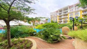 a resort with a pool and a building at Bratanov Harmony Monte Carlo in Sunny Beach
