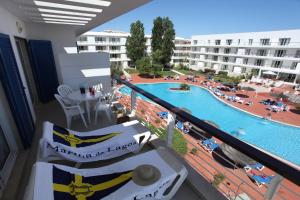 a balcony with a view of a swimming pool at Marina Club Lagos Resort in Lagos