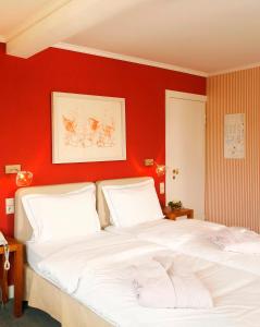 Postel nebo postele na pokoji v ubytování Hotel des Bains & Wellness