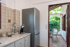 A kitchen or kitchenette at ApteraMare Tradidtional house 'New listing'