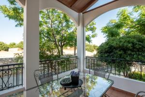 A balcony or terrace at ApteraMare Tradidtional house 'New listing'