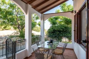 A balcony or terrace at ApteraMare Tradidtional house 'New listing'