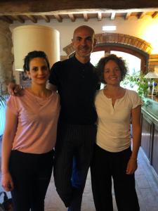 a man and two women posing for a picture at Hotel Giogliano in Radicondoli