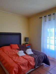 Ein Bett oder Betten in einem Zimmer der Unterkunft Cozi Nova - Costa Nova Beach
