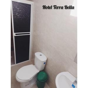 a bathroom with a toilet and a shower at Hotel Terra Bella in Guadalupe