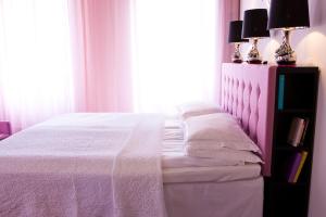 Voodi või voodid majutusasutuse Hotel Flora toas