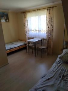 Łóżko lub łóżka w pokoju w obiekcie Cichy Zakątek