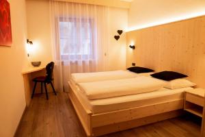 Кровать или кровати в номере Garberhof-Stocker