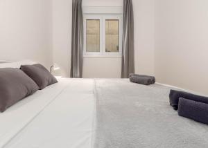 Łóżko lub łóżka w pokoju w obiekcie Bora Apartment Pula