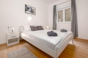 Łóżko lub łóżka w pokoju w obiekcie Bora Apartment Pula