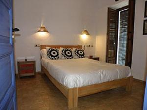 Posteľ alebo postele v izbe v ubytovaní Hostal Extramuros