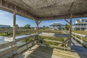 a view from the back porch of a house at Escape in Edisto Island +14 photos