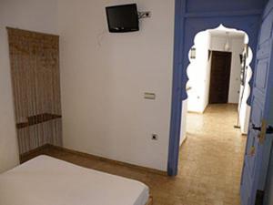 Posteľ alebo postele v izbe v ubytovaní Hostal Extramuros