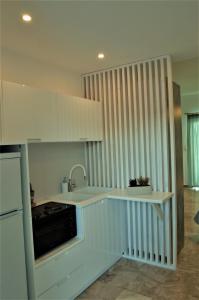 A kitchen or kitchenette at Asmini Studios