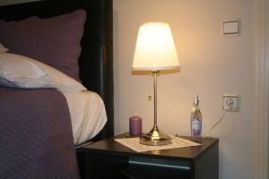 A bed or beds in a room at Konakli Apartments Izmir