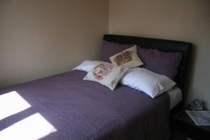 A bed or beds in a room at Konakli Apartments Izmir