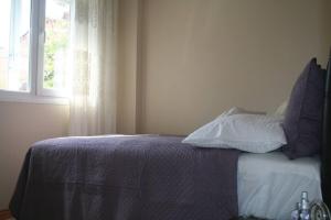 A bed or beds in a room at Konakli Apartments Izmir