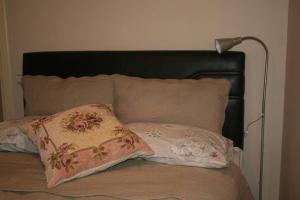 A bed or beds in a room at Konakli Apartments Izmir
