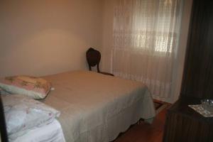 A bed or beds in a room at Konakli Apartments Izmir