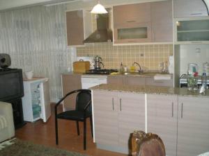 A kitchen or kitchenette at Konakli Apartments Izmir