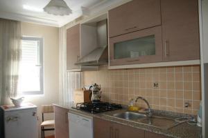 A kitchen or kitchenette at Konakli Apartments Izmir