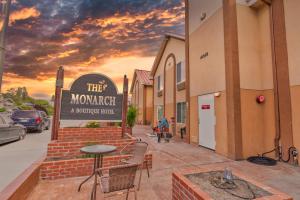 a building with a sign that reads they mortgage a boutique hotel at The Monarch Inn in Mariposa