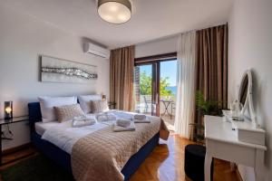 Posteľ alebo postele v izbe v ubytovaní Villa Sonik + 37 fotografií