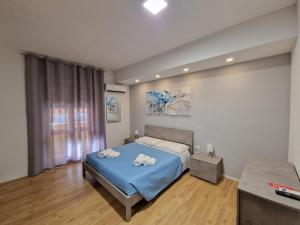 Llit o llits en una habitació de The Shell Guest House