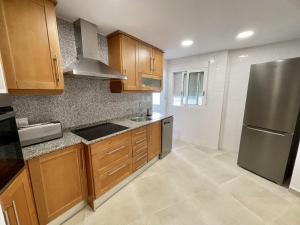 A kitchen or kitchenette at Piso en el Puerto de Dénia con balcón