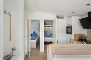 Een stapelbed of stapelbedden in een kamer bij Ferienhaus "TO HUUS" mit kostenfreier Saunanutzung 