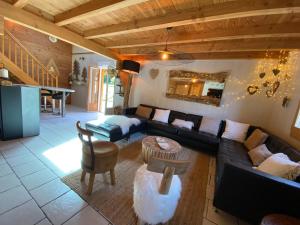 Część wypoczynkowa w obiekcie Gîte Chalet avec bain nordique et piscine 11 pers Hautes Vosges