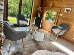 Część wypoczynkowa w obiekcie Gîte Chalet avec bain nordique et piscine 11 pers Hautes Vosges