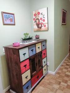 a dresser with colorful drawers in a room at Colores in Oviedo