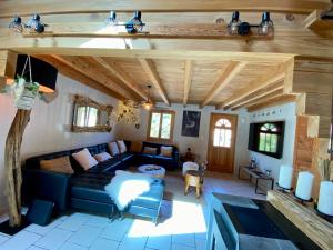 Część wypoczynkowa w obiekcie Gîte Chalet avec bain nordique et piscine 11 pers Hautes Vosges