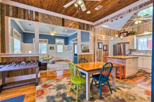 a kitchen and dining room with a table and chairs at Cottage with Porch - 3 Min Walk to Bay St Louis in Bay Saint Louis