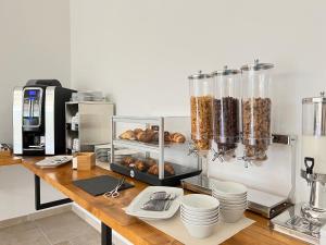 a kitchen with a counter top with food on it at Agriturismo Antichi Ulivi in Mattinata