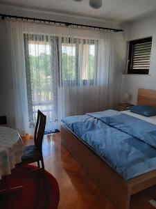 Ein Bett oder Betten in einem Zimmer der Unterkunft Apartment Ivan