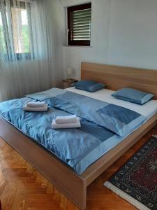 Ein Bett oder Betten in einem Zimmer der Unterkunft Apartment Ivan