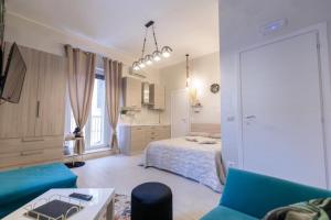 a living room with a bed and a couch at Suite16 & spa in Barletta