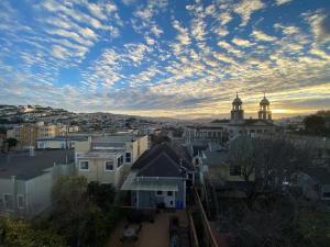 a view of a city with buildings and a cloudy sky at Beautiful 3 Bed 3 Bath upper house in Bernal Glen in San Francisco