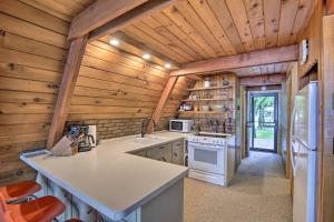 a kitchen with wooden walls and a wooden ceiling at Lake Pepin Cottage with Decks and Private Beach! in Stockholm