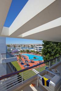 a view of the pool from the balcony of a resort at Marina Club Lagos Resort in Lagos